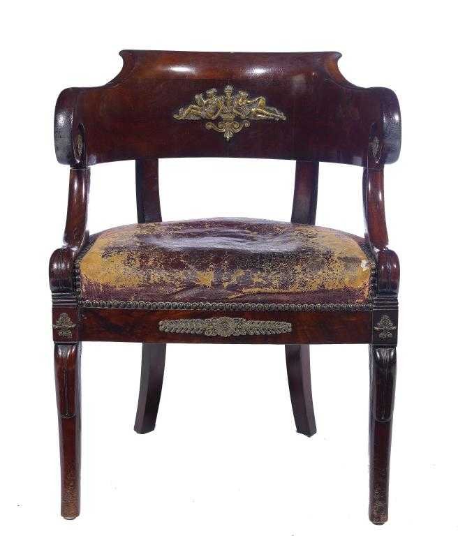 Appraisal: A FRENCH EMPIRE MAHOGANY ARMCHAIR with gilt bronze bas reliefs