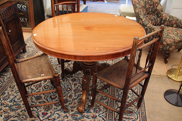 Appraisal: A CIRCULAR MAHOGANY BREAKFAST TABLE the tilt top on carved