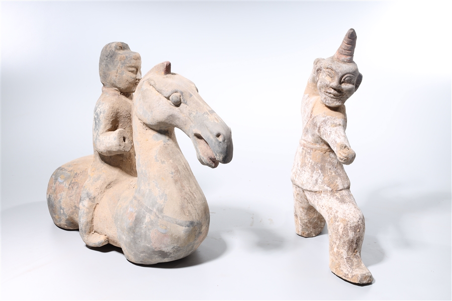 Appraisal: Two Chinese Tang-style pottery figures including a kneeling archer and