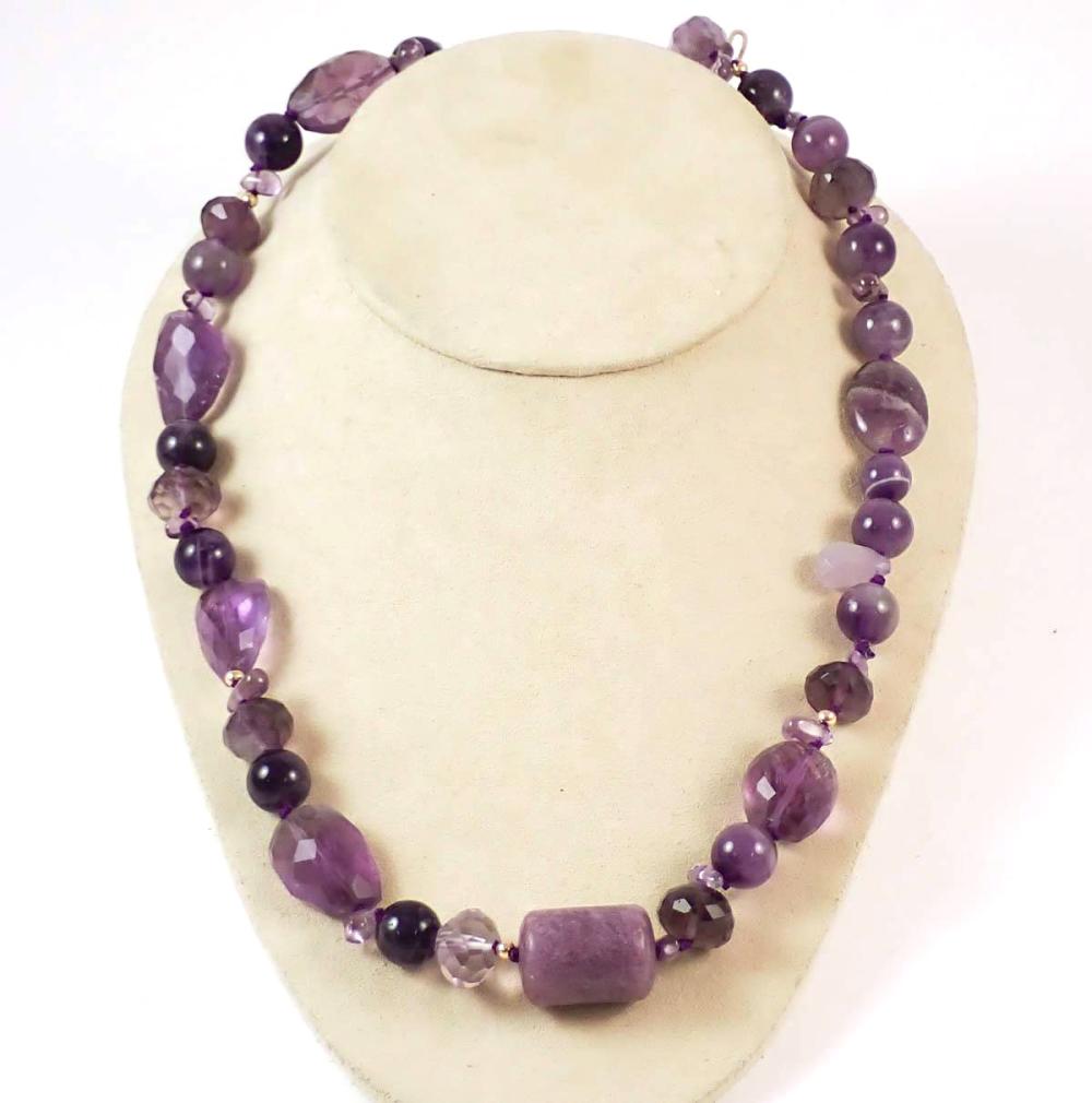 Appraisal: MATINEE LENGTH AMETHYST BEAD NECKLACE hand-knotted strand of amethyst beads