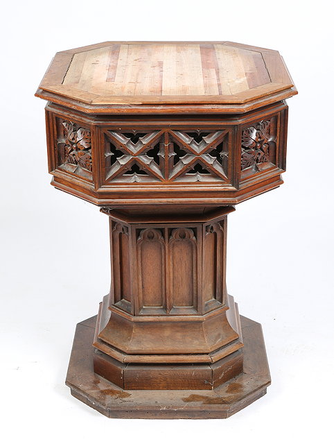 Appraisal: A VICTORIAN WALNUT SQUARE FONT with canted corners and pierced