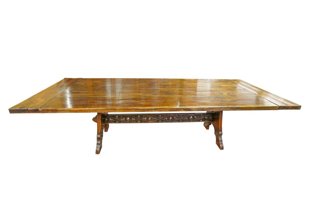 Appraisal: GOTHIC REVIVAL STYLE WALNUT TRESTLE TABLEwith four-plank top and breadboard