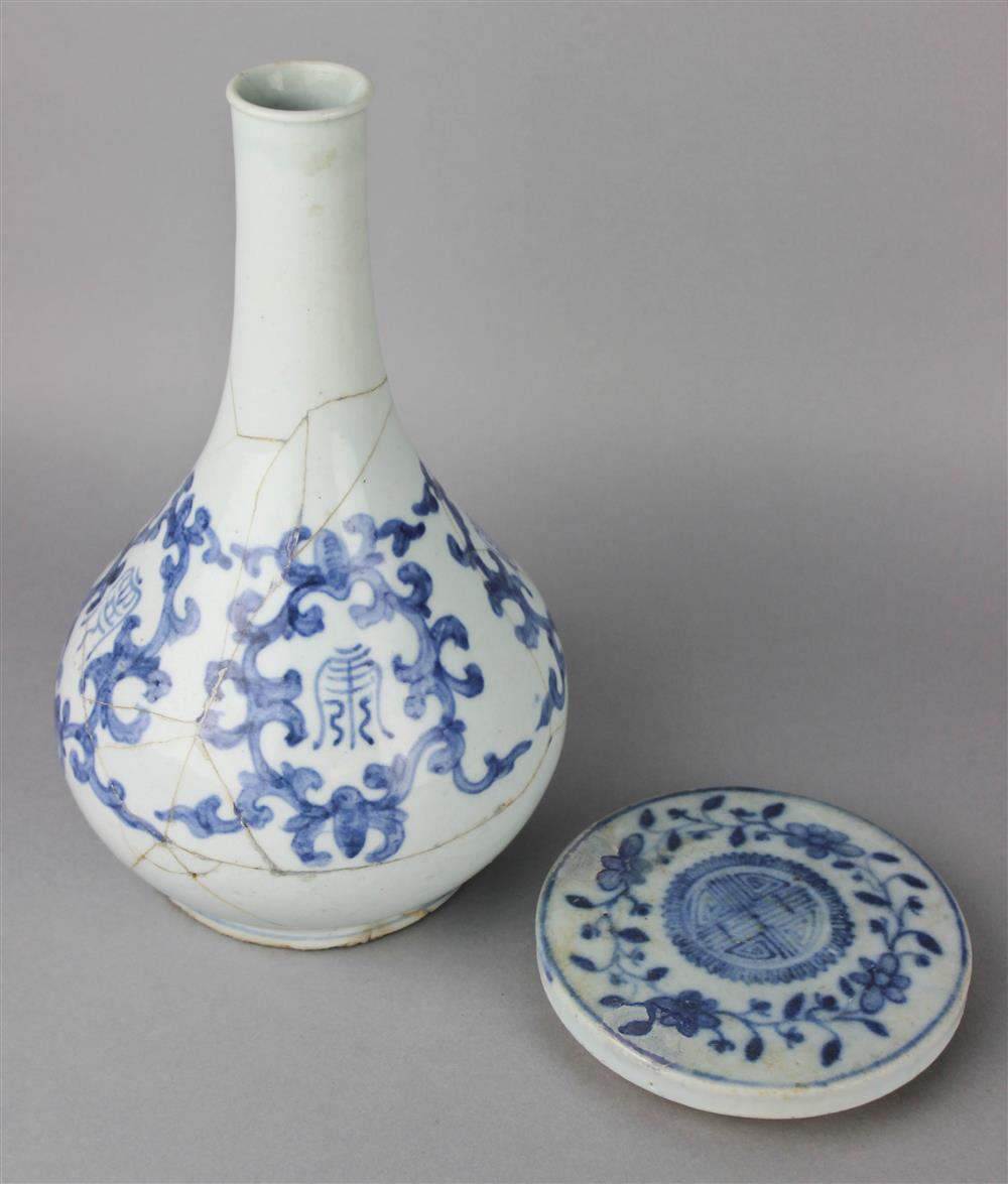 Appraisal: BLUE AND WHITE WINE BOTTLE AND A CIRCULAR COVER CHOSON