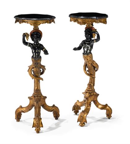 Appraisal: Pair of Italian carved and painted blackamoor torcheres The cartouche