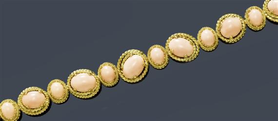 Appraisal: A CORAL AND GOLD BRACELET Yellow gold Decorative bracelet composed