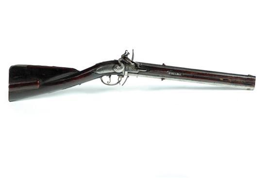 Appraisal: FLINTLOCK SWIVEL BREECH RIFLE European th century octagon barrels with