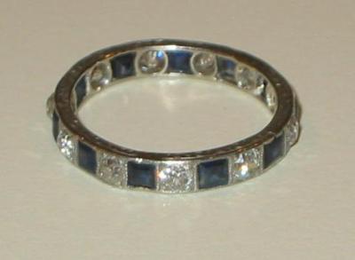 Appraisal: A SAPPHIRE AND DIAMOND ETERNITY RING comprising alternating brilliant cut