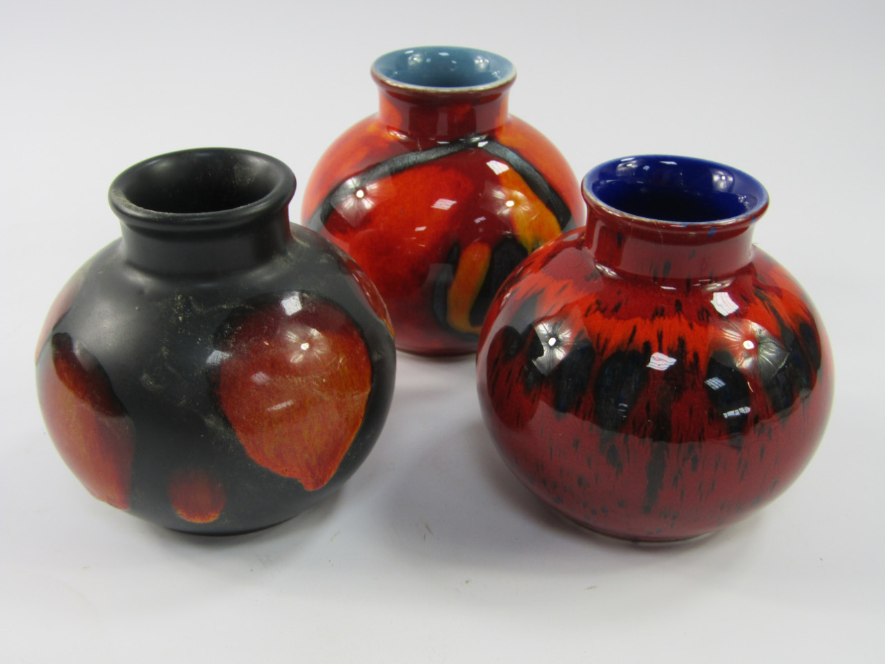 Appraisal: Three Poole Pottery vases of squat spherical design cm high