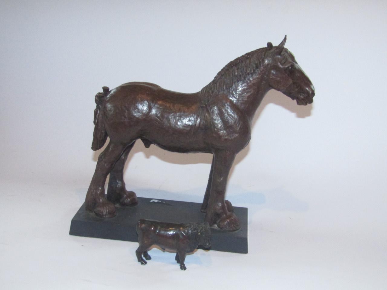 Appraisal: A small bronze figure of a shorthorn bull with brown