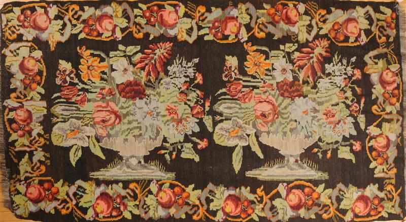 Appraisal: BESSARABIAN BLACK-GROUND LONG RUG Worked with colorful floral sprays within