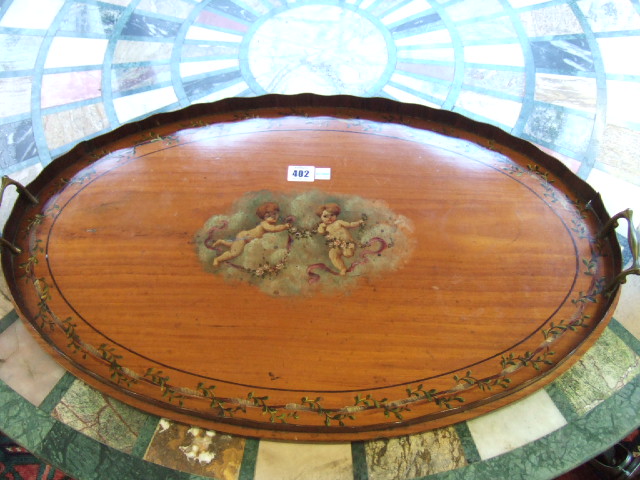 Appraisal: An Edwardian satinwood two handled serving tray of oval outline