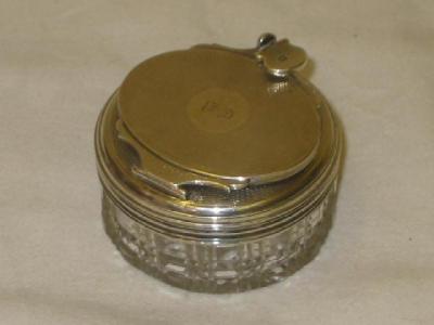 Appraisal: A WILLIAM IV TRAVELLING INKWELL of circular form the engine