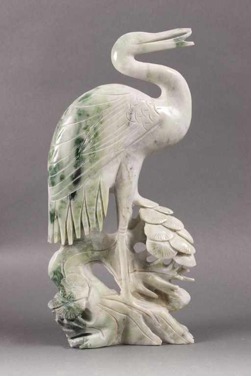 Appraisal: Chinese carved hardstone crane modeled as crane standing on scholar