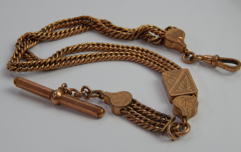 Appraisal: A gold plated watch chain with floral engraved breaks