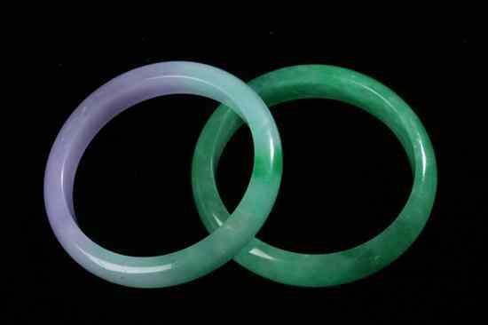 Appraisal: TWO CHINESE APPLE GREEN AND LAVENDER JADEITE BANGLES - Inside