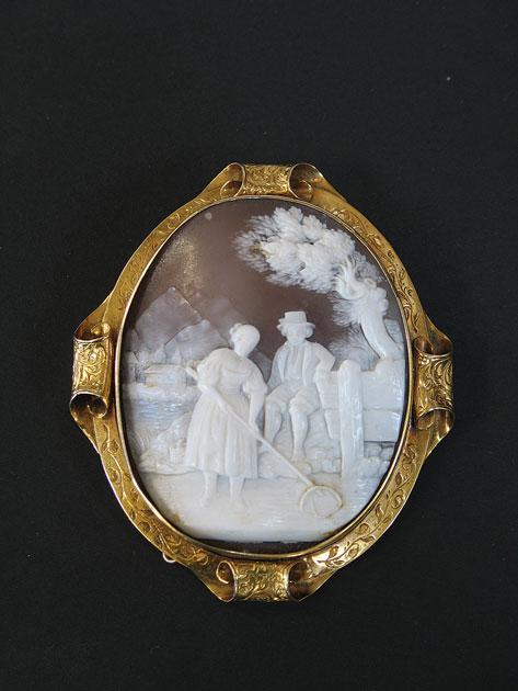 Appraisal: A TH CENTURY OVAL SHELL CAMEO depicting a fisher-woman with