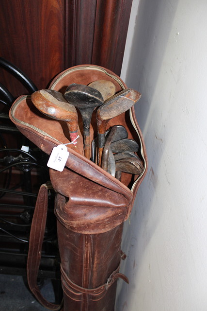 Appraisal: A GROUP OF GOLF CLUBS in a leather case to