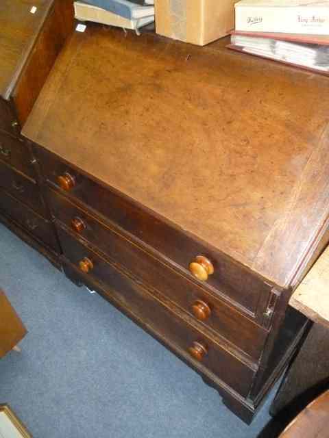 Appraisal: A GEORGIAN MAHOGANY BUREAU the fall front enclosing a fitted