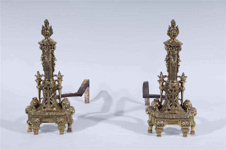 Appraisal: Pair of brass gold fireplace andirons with elaborate gold design