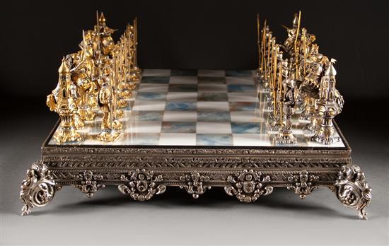 Appraisal: Giuseppe Vasari Gilt metal figural chess set with silvered metal