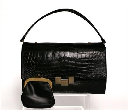 Appraisal: Black Rosenfield alligator purse s With etched gold-tone latch single