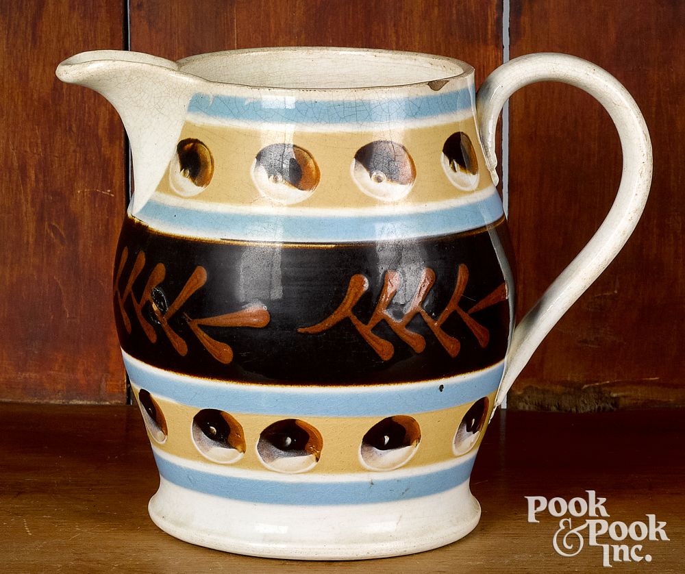 Appraisal: Mocha pitcher with cat's-eye and twig decoration Mocha pitcher with