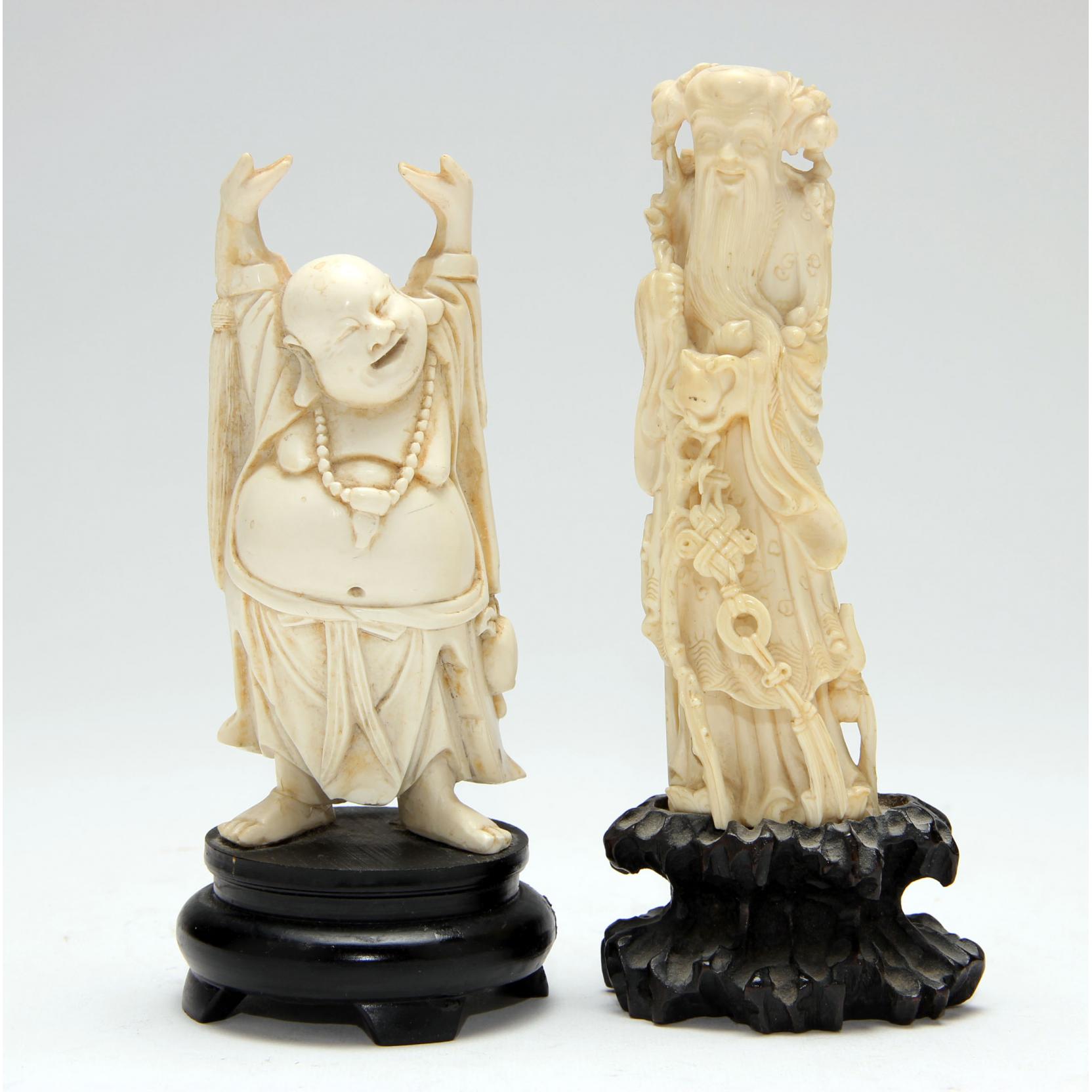 Appraisal: Pair of Ivory Chinese Deities the first a laughing Hotei