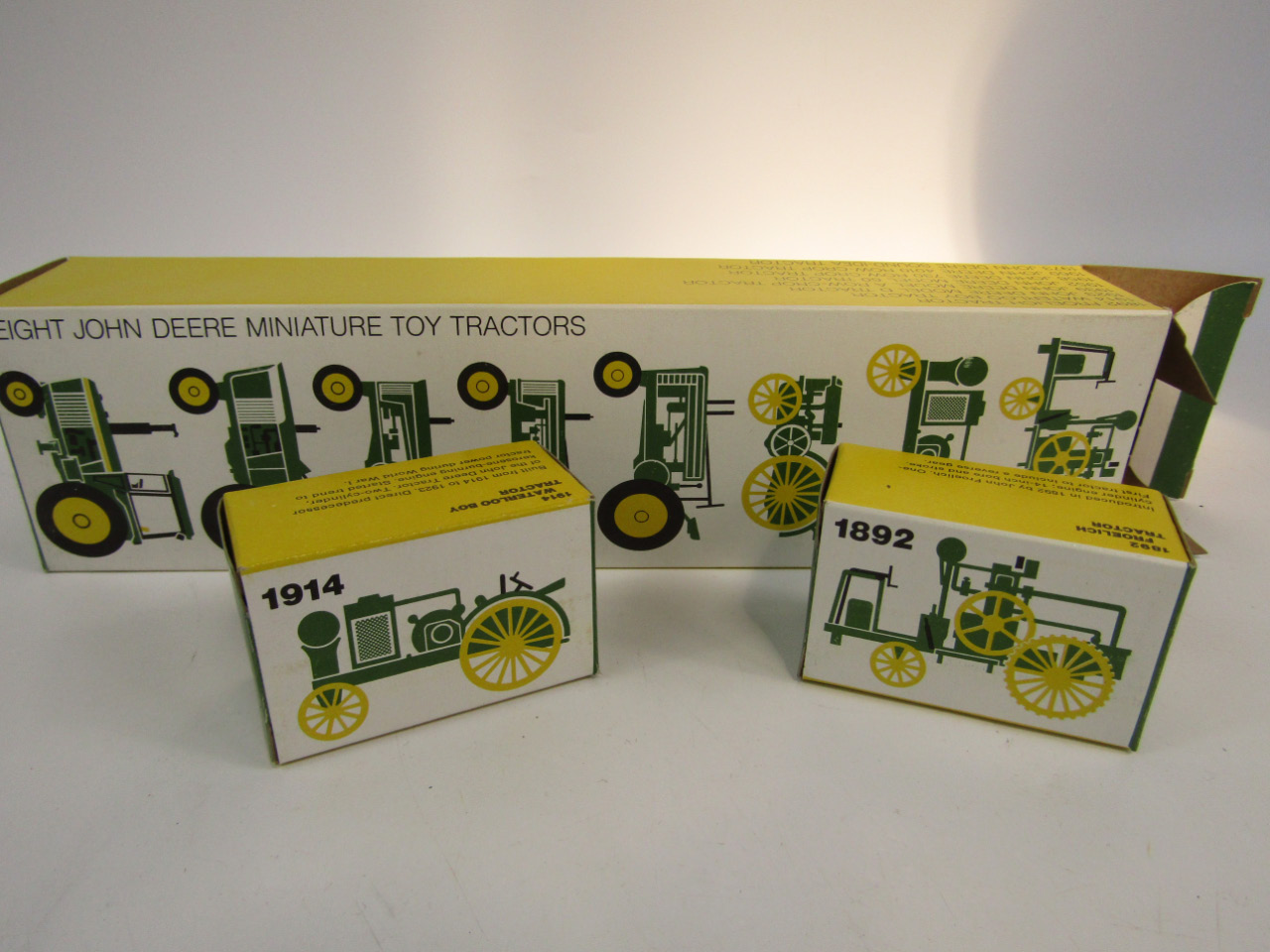 Appraisal: A John Deere miniature toy tractor die cast set to