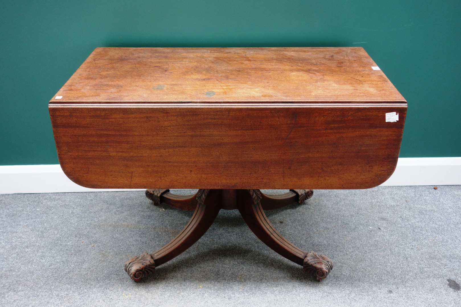 Appraisal: A George III mahogany drop flap centre table with end