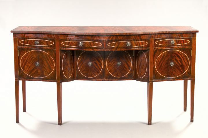 Appraisal: George III-Style Mahogany Sideboard the bowed top banded and above