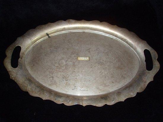 Appraisal: A tray of wavy oval outline with pierced handles cm