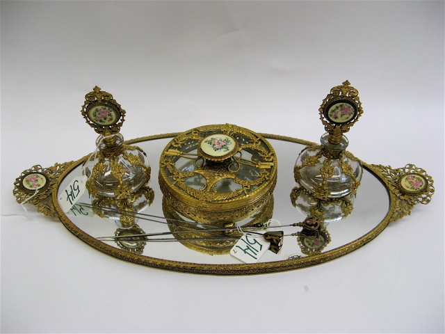 Appraisal: A GILDED DRESSER TRAY SET THREE HAT PINS pieces the