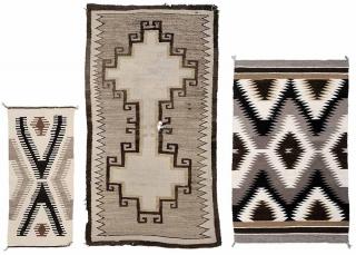 Appraisal: Two Navajo Rugs and a Saddle Blanket American th century