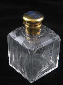 Appraisal: A shallow rib cut glass perfume bottle with silver gilt