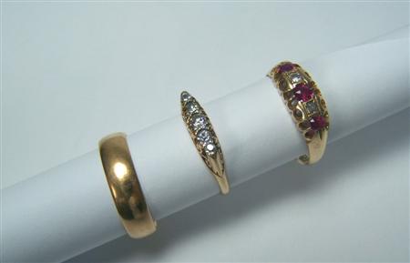 Appraisal: An ct gold mounted ruby and diamond five-stone ring claw