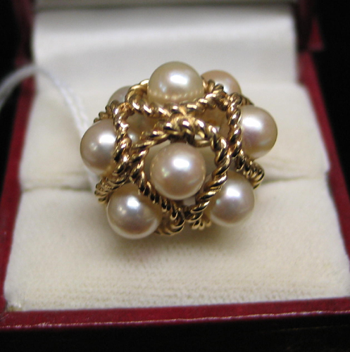 Appraisal: PEARL AND FOURTEEN KARAT GOLD RING set with eight round