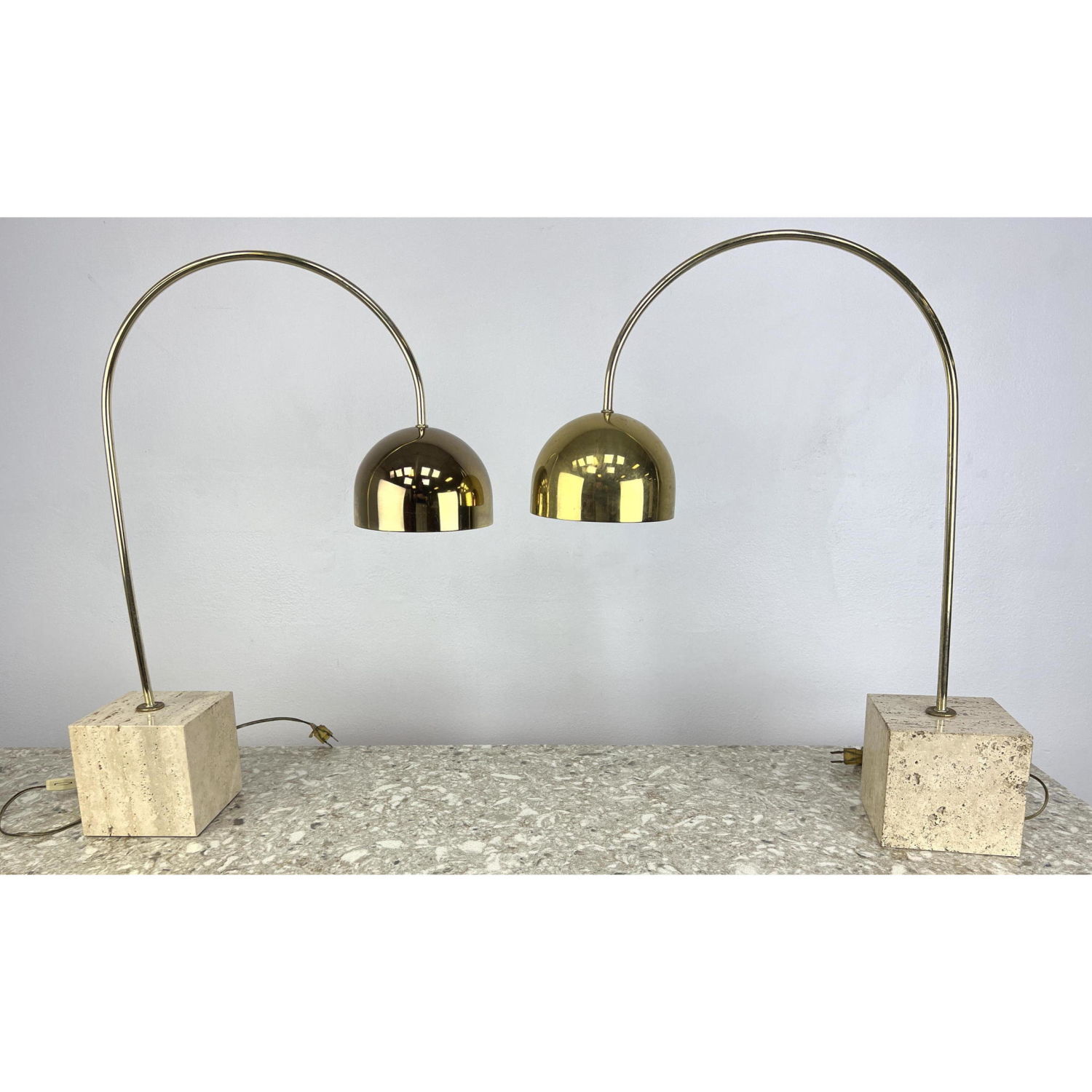 Appraisal: Pair GUZZINI BRASS AND TRAVERTINE MARBLE ARC TABLE LAMP Dimensions