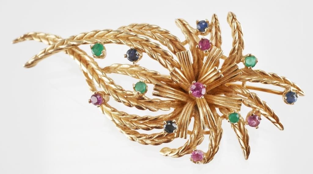 Appraisal: k yellow gold brooch with a bursting ribbon floral design