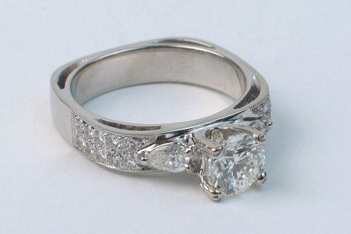 Appraisal: DIAMOND AND FOURTEEN KARAT WHITE GOLD RING centering a round