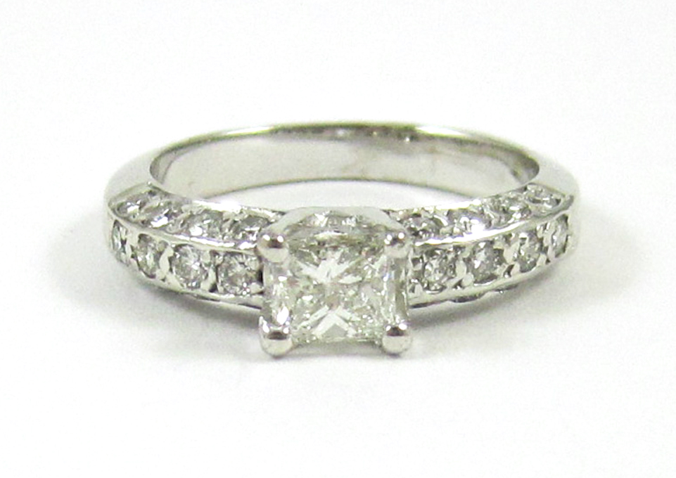 Appraisal: DIAMOND AND FOURTEEN KARAT WHITE GOLD RING with round-cut diamonds