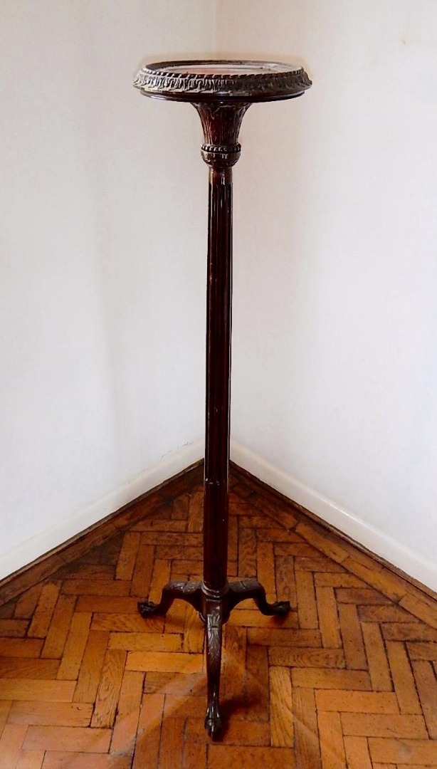 Appraisal: A mahogany torchere with circular platform and tripod base cm