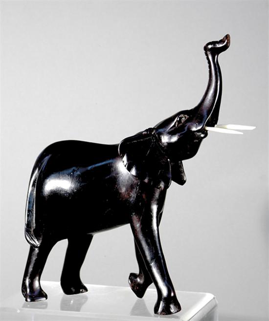 Appraisal: Asian school th century TWO WORKS ELEPHANT and DOLPHINcarved ebony