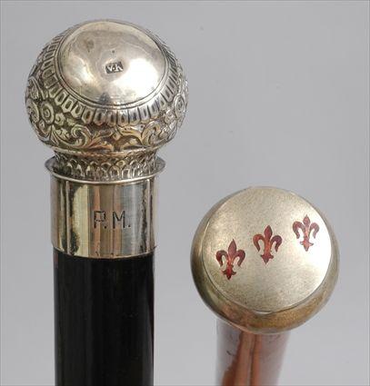 Appraisal: TWO SILVER-HANDLED CANES The one German with scrollwork and hook