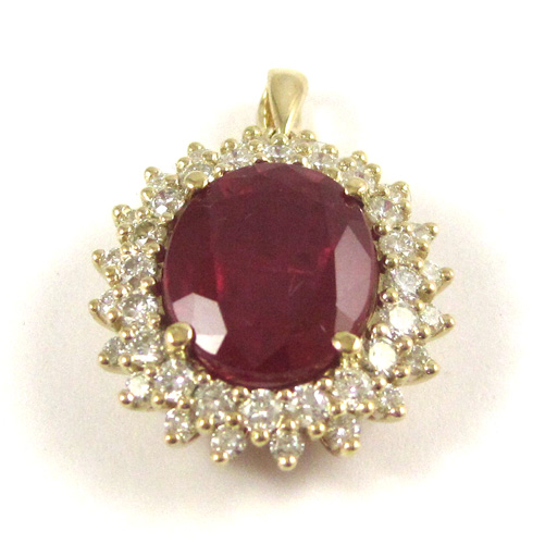 Appraisal: RUBY DIAMOND AND FOURTEEN KARAT GOLD PENDANT with round-cut diamonds