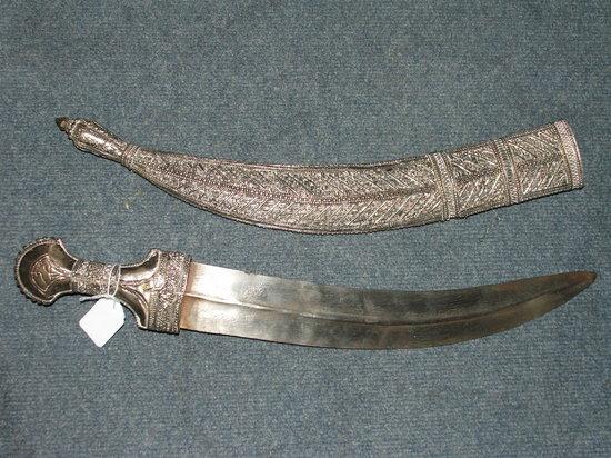 Appraisal: A PERSIAN SHORT SWORD or Jambiya with decorative silver coloured