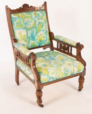 Appraisal: An Edwardian open armchair on turned front legs