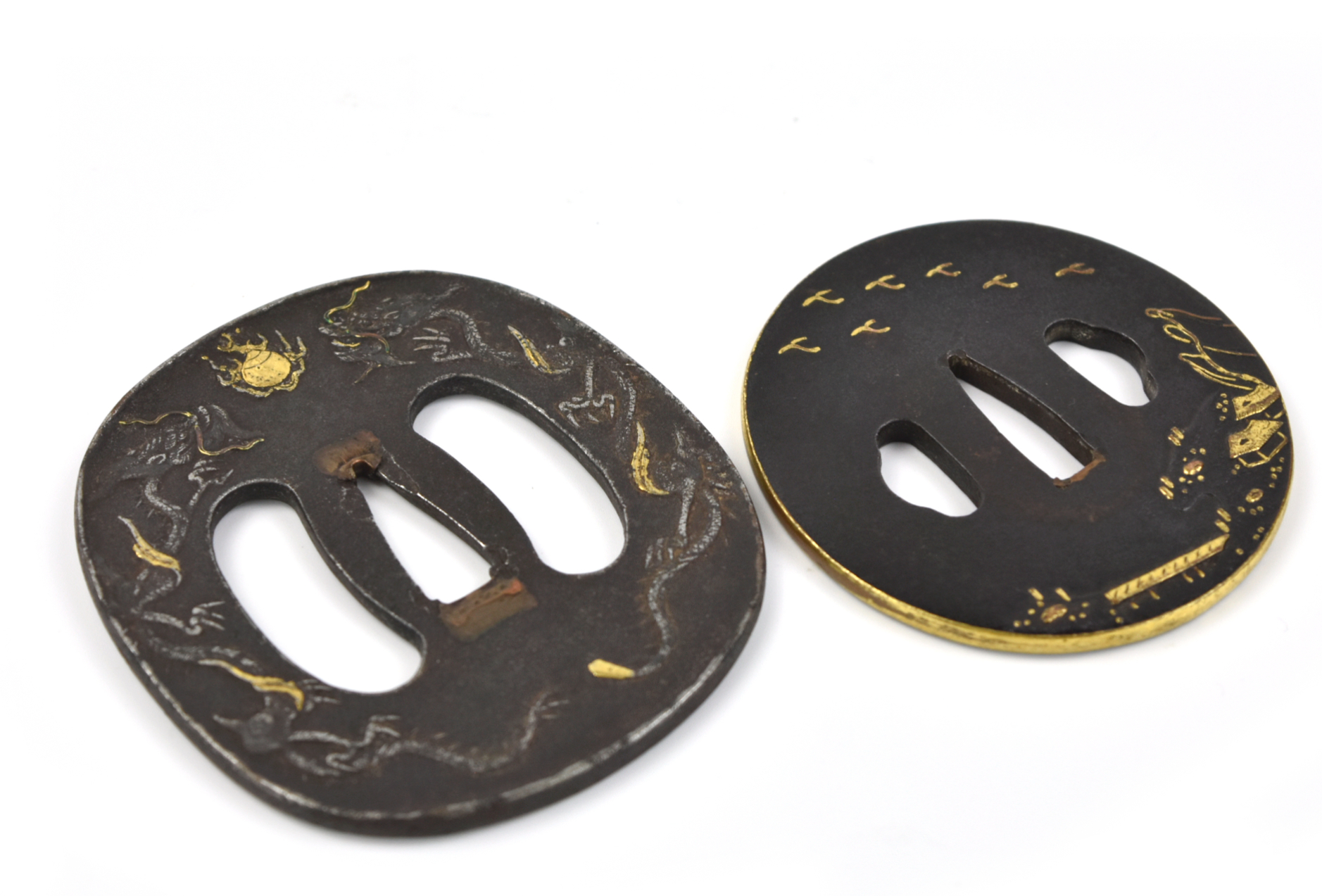 Appraisal: Japanese two shakudo tsuba with iroe takazogan on a nanako