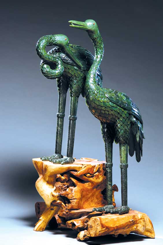 Appraisal: PAIR MASSIVE SPINACH JADE CRANES Cranes are possibly one of