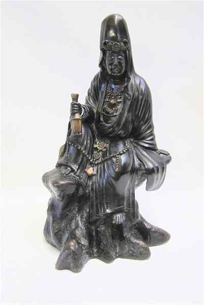 Appraisal: CHINESE BRONZE FIGURE depicting a well-to-do merchant barefoot seated on