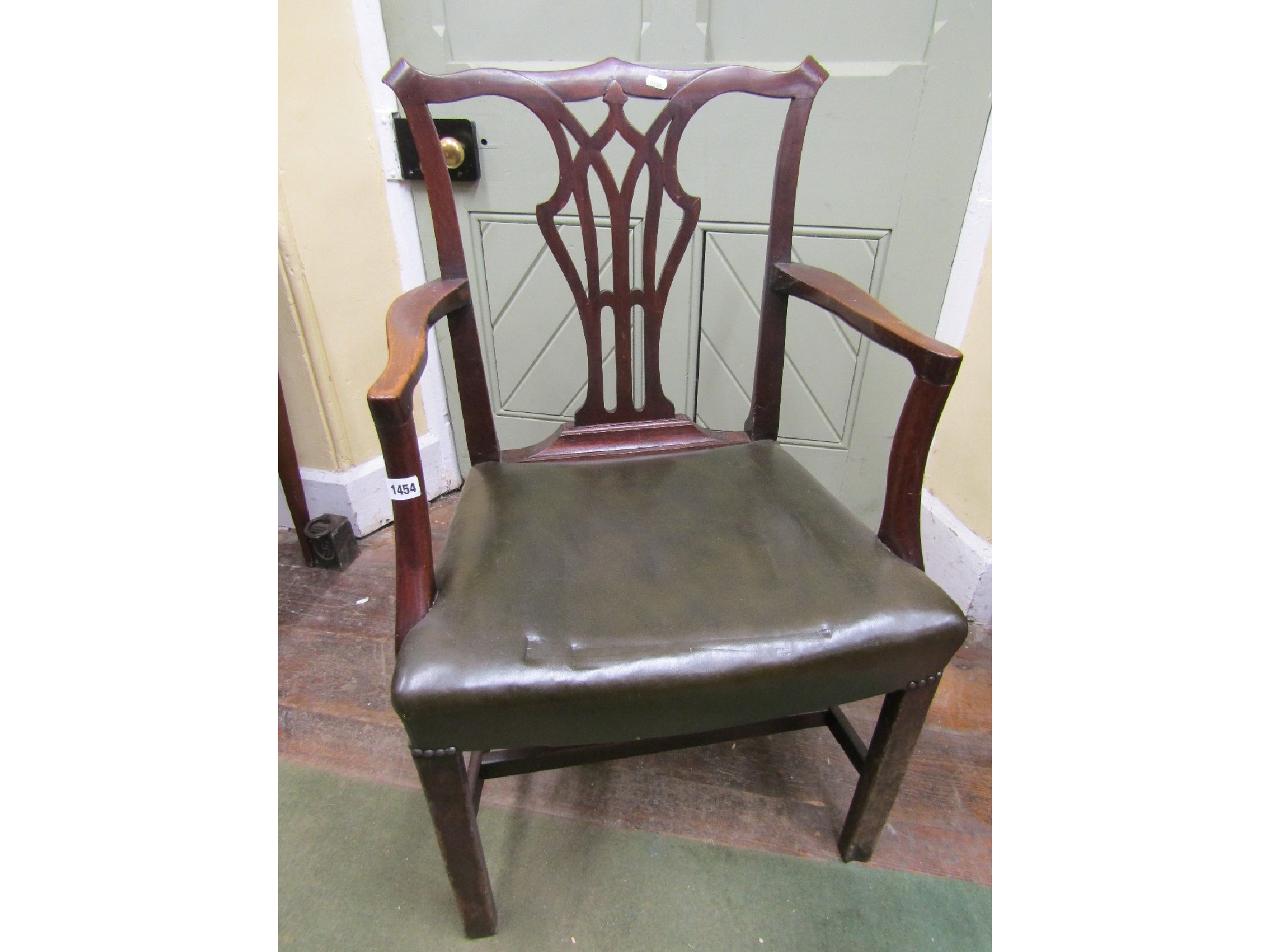 Appraisal: A Georgian mahogany elbow chair with carved and pierced splats